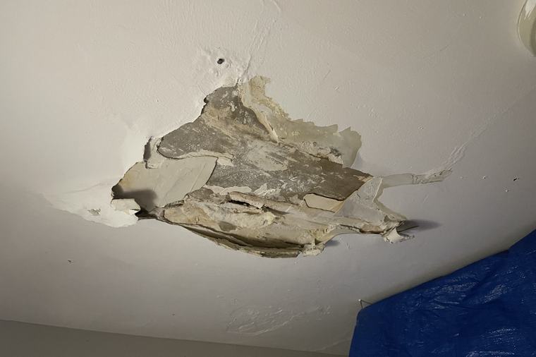 A plaster ceiling that has let go, opened up to find the cause