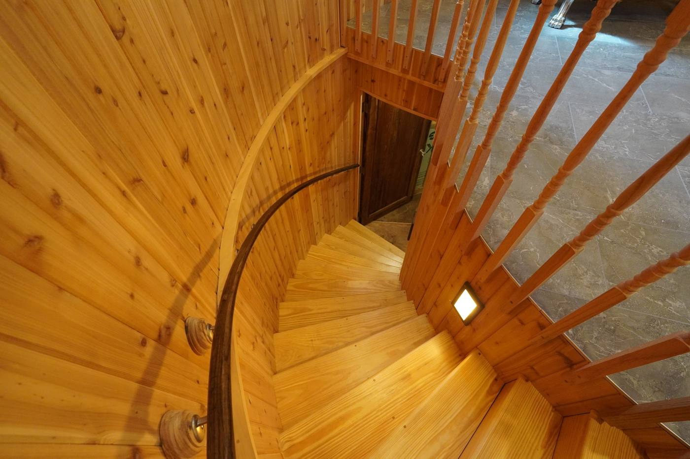A curved cedar staircase inside a converted grain silo